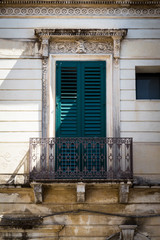 Fototapeta na wymiar Shuttered Window of a House in Sicily