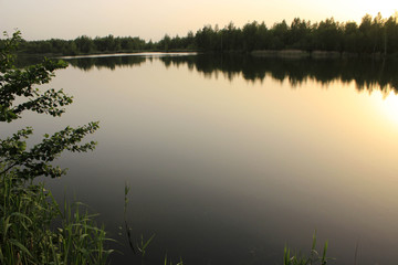 sunset on the lake in the spring