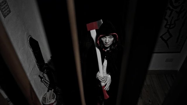 4k Halloween Shot of an Evil Woman with Axe looking suspicious