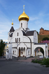 Fototapeta na wymiar Old church amid Kremlin towers in Nizhny Novgorod