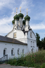 The old Church with green domes on blue sky background in Nizhny Novgorod.