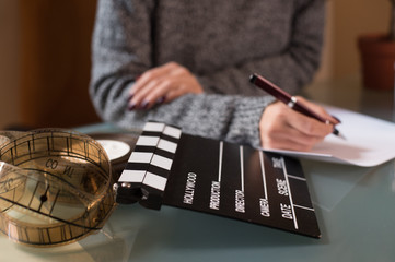 Artist screenwriter desktop detail clapper board