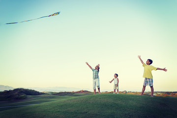 Obraz na płótnie Canvas Little boy on summer vacation having fun and happy time flying k