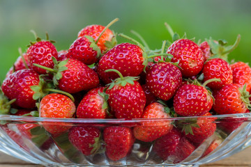 Fresh strawberry fruit in a glass dish