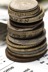 Column of metal coins. The concept of saving. Coins stacked on e