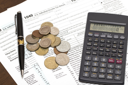 US 1040 tax form with pen