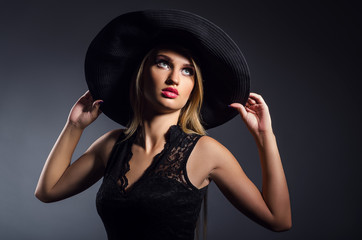 Fototapeta na wymiar romantic girl in a hat with a wide brim