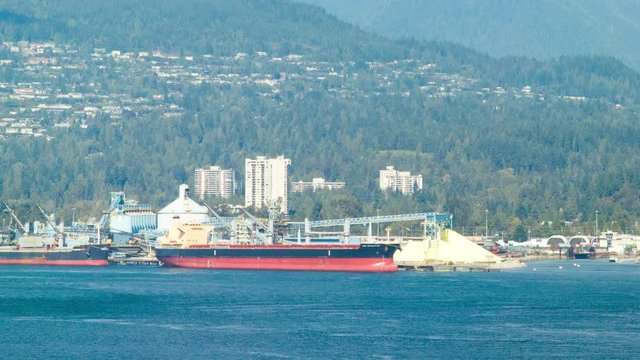 Cargo Ship Docked at Vancouver Shipyards Canada in the Harbour on a Sunny Day in British Columbia
