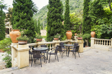 scene of tea table for relax in conner of garden - can use to display or montage on product