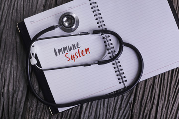 "Immune System" Word on Note book With Stethoscope