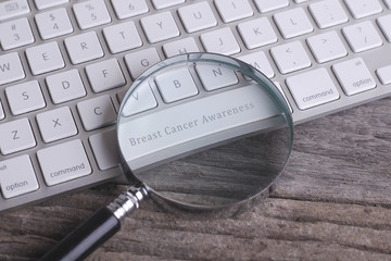 Health concept: Breast Cancer Awareness on computer keyboard