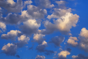 Fototapeta na wymiar White fluffy clouds in blue sky