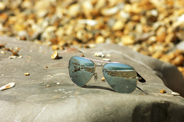 Sunglasses lying on the beach