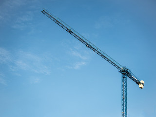 Construction crane isolated under blue sky