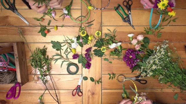 Master class of a florist making flower ring.