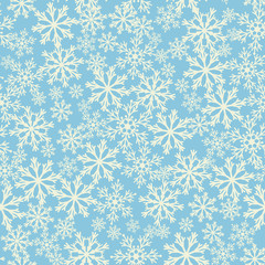 Seamless blue background with snowflakes. Pattern snowfall.