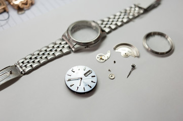 Detail of watch machinery on the table.