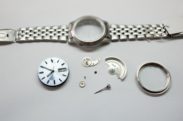 Detail of watch machinery on the table.