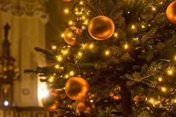 Details of Christmas tree in old polish catholic church. - obrazy, fototapety, plakaty