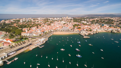 yacht near beautiful beach and marina of Cascais Portugal aerial view - obrazy, fototapety, plakaty