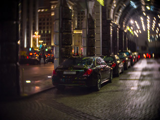Expensive cars at the entrance to the Ritz Carlton Moscow with the view on Tverskaya street