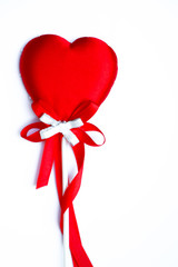 Red heart ribbon on white background, greeting card