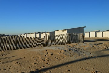 Fototapeta na wymiar CABINS ON THE BEACH OF CALAIS IN WINTER , PAS DE CALAIS, HAUTS DE FRANCE , FRANCE