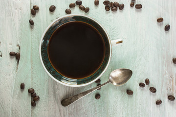 Cup of coffee with grains and copyspace