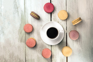 Coffee with macarons and copyspace, overhead shot