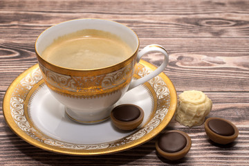 a cup of coffee with sweets