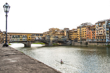 Obraz premium Ponte Vecchio in Florence Italy, Bridge with Shops, Arno