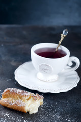 eclair with powdered sugar