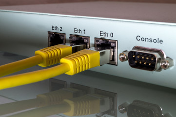 close up, detail of a firewall with two connected network cables