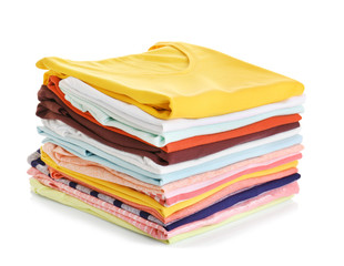 Stack of colorful clothes on white background, closeup
