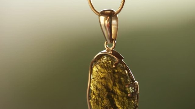 Czech stone "vltavin" . Moldavit stone. Slow motion