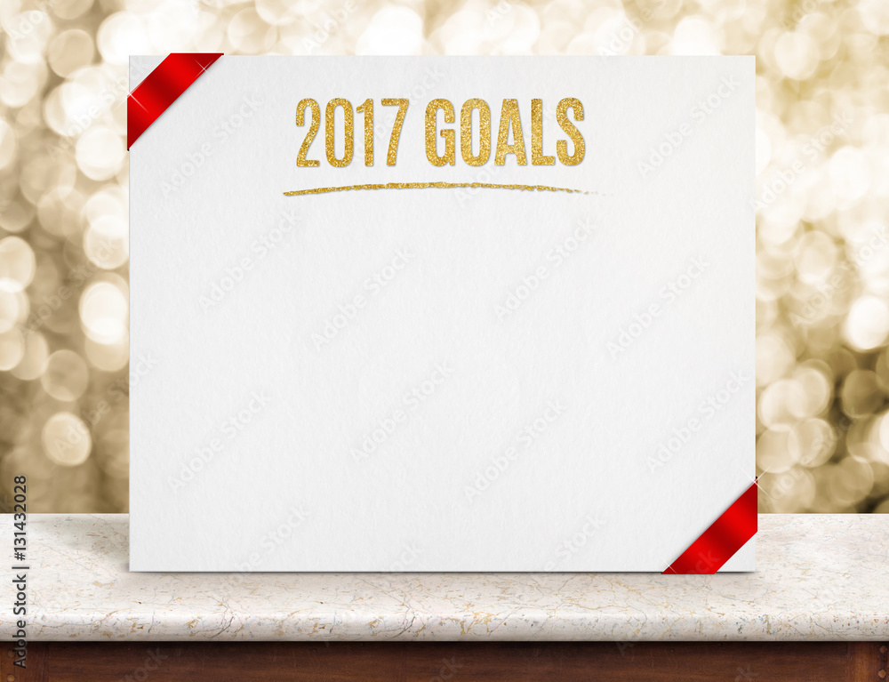 Poster 2017 goals on paper poster with red ribbon on marble table top a
