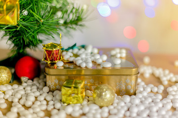 Obraz na płótnie Canvas Gift boxes and ornaments in Merry Christmas and Happy New Year concept with bokeh background, can be use for make a greeting cards.