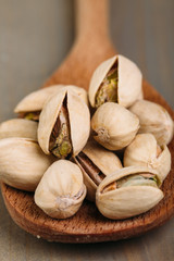 Pistachios on wooden background