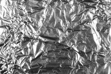 Abstract crumpled silver aluminum foil background texture