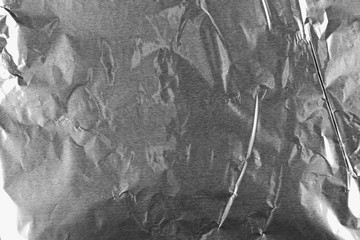 Abstract crumpled silver aluminum foil background texture