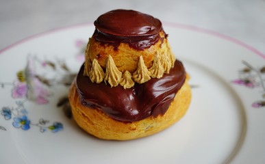 A chocolate religieuse pastry in France