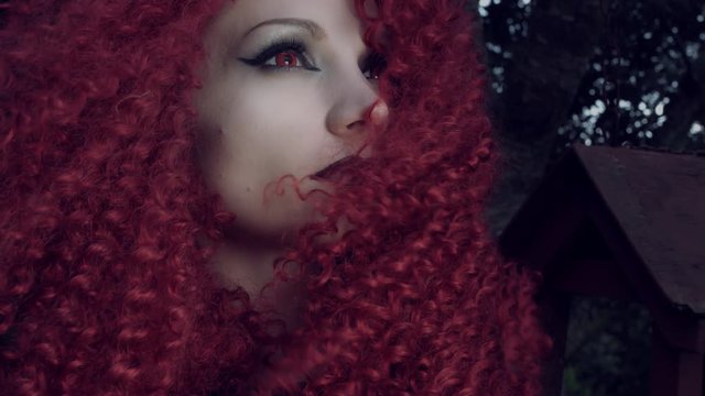 4k Halloween Shot of Red Riding Hood Looking at the Sky, face close-up