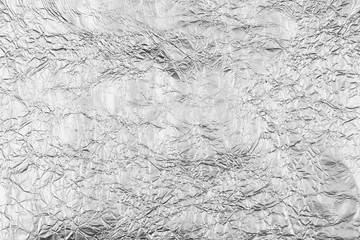 Abstract crumpled silver aluminum foil background texture