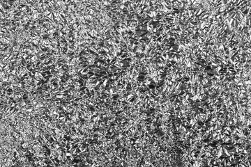 Abstract crumpled silver aluminum foil background texture