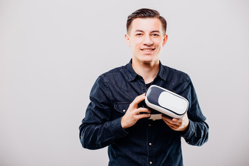 Young man with virtual reality glasses isolated on white background