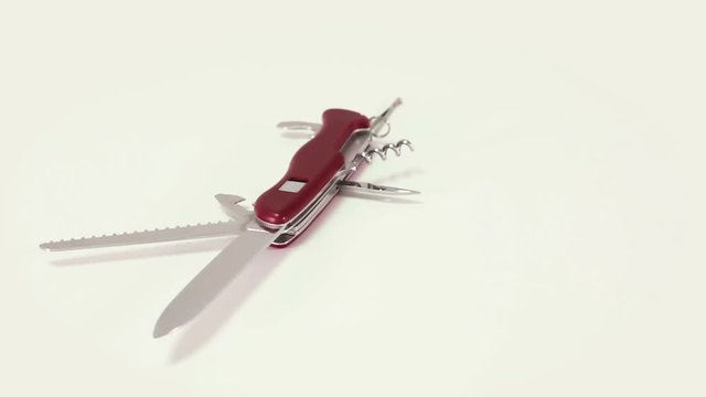 Steel penknife turning around.