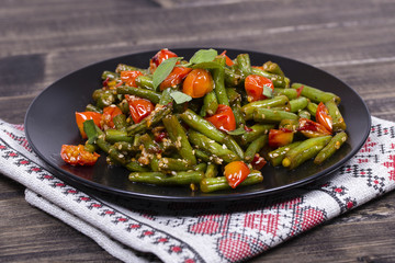 Healthy green beans, red cherry tomato with sesame seeds