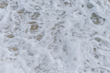 Texture of waves breaking on the beach