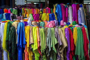 Colorful textile at market. For shopping, industry, sale 