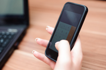 Closeup of hands of beautiful business woman working with comput
